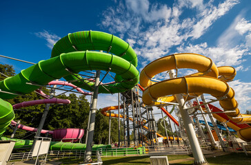 Green and yellow water slide in aquapark