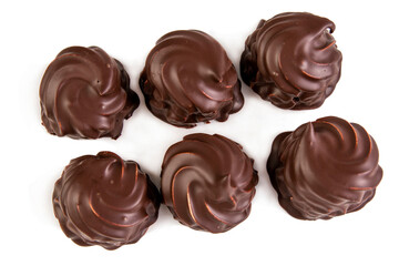 Appetizing handmade chocolate marshmallow. Sweets and pleasure in food. Close-up. Top view. Isolated on white background.