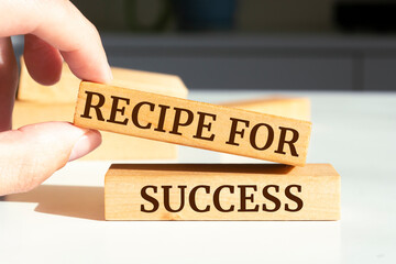 Wooden blocks with words 'Recipe for Success'.