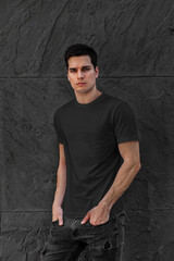 Men black t-shirt mockup with model black wall background