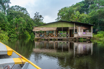 Fototapeta na wymiar Traditional wooden house on the Amazon river
