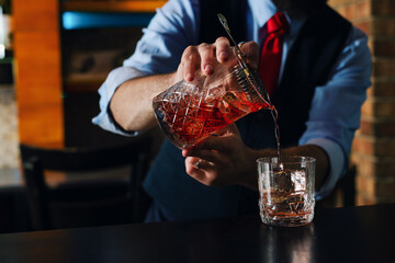 Bartender guy working prepare cocktail skills