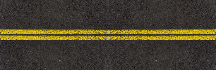 Lignes jaunes sur asphalte 