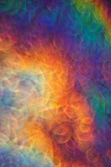 bright abstract iridescent background with bokeh holography