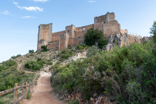 Beautiful landscape photo with the road leading to the chirel castle of cortes del pallas, Valencian community, Spain
