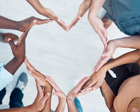 Teamwork hands, heart and diversity partnership, business people support or community care, motivation and trust. Above group team building for charity, kindness and global solidarity, love and hope