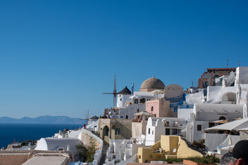 Cityscape of Oia with windmills overlooking sea - 539651571