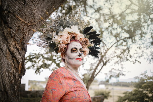 Portrait of Mexican woman made up as a catrina.