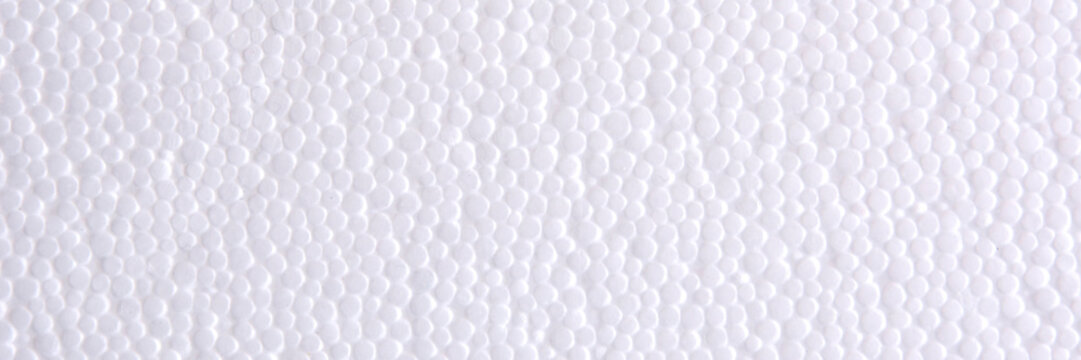 Panoramic header banner of White Polystyrene or styrofoam texture background. Styrofoam board for backdrop. Copyspace for text. Selective focus. © Vlyaks