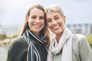Happy, mother and daughter with smile in nature together in the city of Australia. Face portrait of...