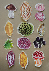 Application of mushrooms, autumn leaves and decorative elements painted with watercolors