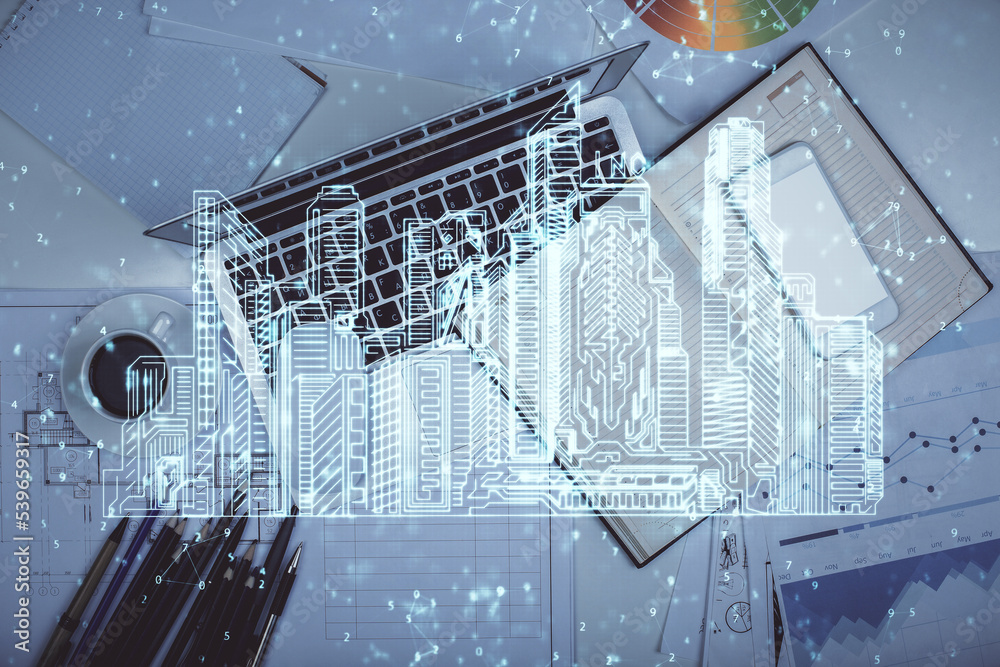 Poster city drawing over computer on the desktop background. top view. double exposure. smart home concept.