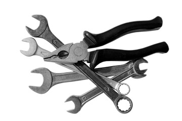 Wrench and pliers on white isolated background. Construction home metal tools