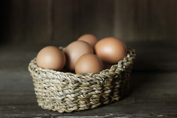 Fresh chicken eggs in a basket