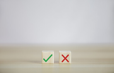 Wooden blocks show right and wrong signals, concepts, decisions, votes, and think yes or no. 