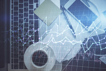 Double exposure of financial chart drawing over table background with computer. Concept of research and analysis. Top view.