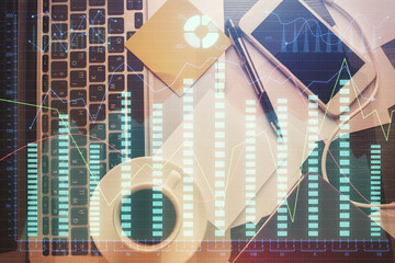 Double exposure of financial chart drawing over table background with computer. Concept of research and analysis. Top view.