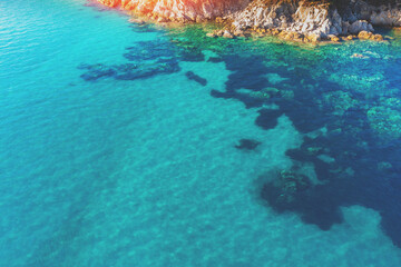 Seascape on a sunny day. View from above. Rocky beach in Vourvourou Greece