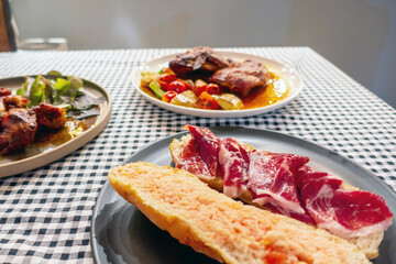 The closed up of European food such as chicken bread ham on table in restaurant. 