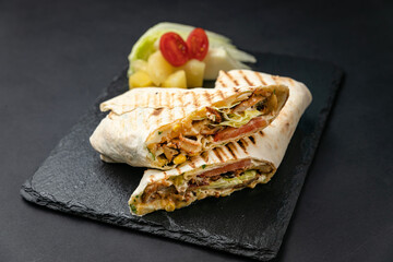 tasty shawarma on a dark background. Close-ups

