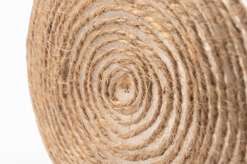 close-up of brown jute twine for DIY and gift wrapping, isolated on white background, concept of zero waste or sustainable lifestyle.