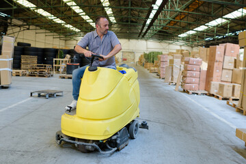 portrait of a warehouse worker with forklift
