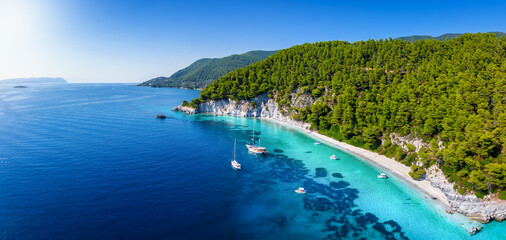 Panoramic landscape view of the beautiful coast of Skopelos island with turquoise sea at pristine...