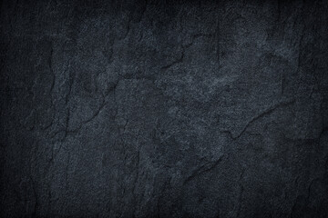 dark gray stone or black slate stone background or texture