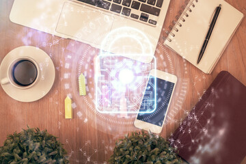Double exposure of lock drawing over desktop. Top view. Security concept.