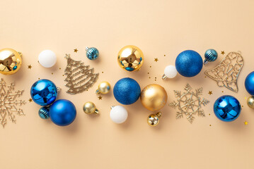 Christmas decorations concept. Top view photo of snowflake fir jingle bell ornaments white blue gold baubles and confetti on isolated beige background