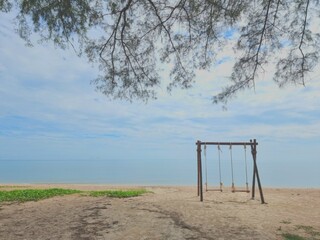 Romantic swings in Samila beach Thailand watching in the morning