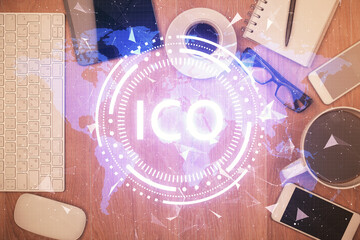 Double exposure of blockchain theme hologram over table with phone. Top view. Crypto technology concept.