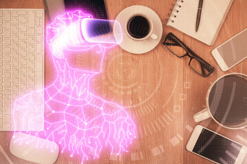 Double exposure of drawing man in AR glasses over table with phone. Top view. VR concept.