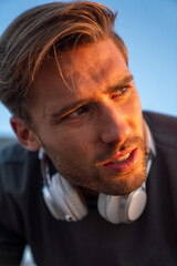 Young fit man take a little break after training outdoor. Fitness sport people lifestyle concept