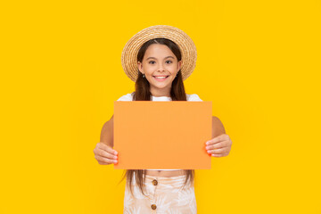 happy teen girl with copy space on orange paper on yellow background