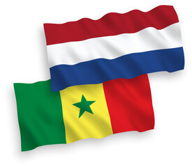 Flags of Republic of Senegal and Netherlands on a white background
