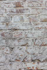 Old brick wall painted with white paint