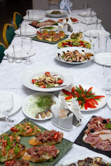sandwiches and snacks on a table with a white table, a festive table