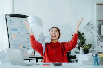 Photo of Angered furious Asian business lady sit chair throw up document graph papers at her...