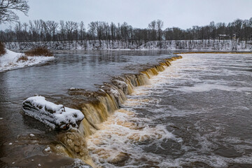 Winter landscape. Venta Rapid (Ventas rumba), waterfall on the Venta River in Kuldiga, Latvia....