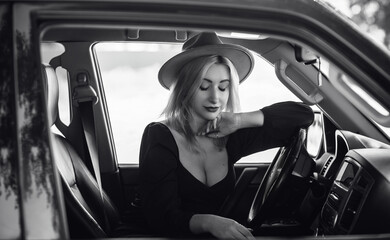 Fototapeta na wymiar Gorgeous blonde woman in a car, luxury style, concept lady and automobile vibe