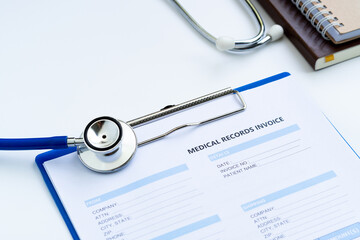 Stethoscope with medical records invoice. on white background.