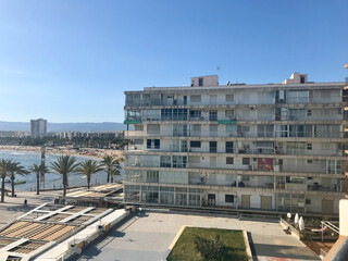 Fototapeta premium Salou, Spain, June 2019 - A tall building in a city