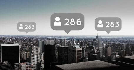 Composite of profile icons and multiple numbers in speech bubbles over aerial view of modern city