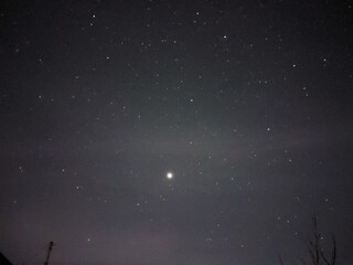 Bright night starry sky in the village