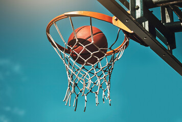 Basketball, goal and target in basket for sports match training on outdoor athletic court. Aim,...