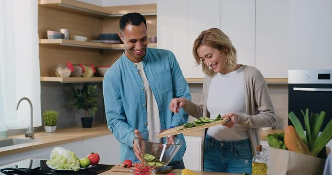 Multiethnic Couple In The Kitchen Preparing The Healthy Breakfast In The Morning They Cooking Together. Healthy Lifestyle And Enjoying Quality Leisure Time At Home.