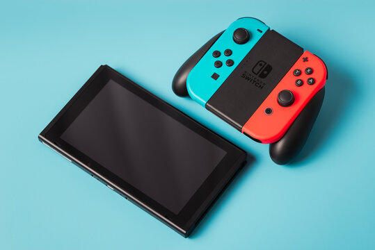 Milan, Italy-Oct. 2022: Nintendo Switch Game Console  isolated copy space on blue background.