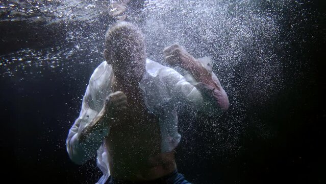 training with weights under water to train fortitude and endurance in professional boxing