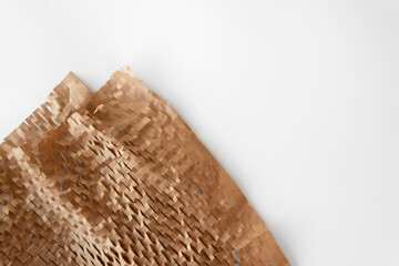 Honeycomb Environmental friendly paper hexagonal shape made of cardboard recycled craft brown paper background lightweight bubble wrapping strength for protective packaging with space white background
